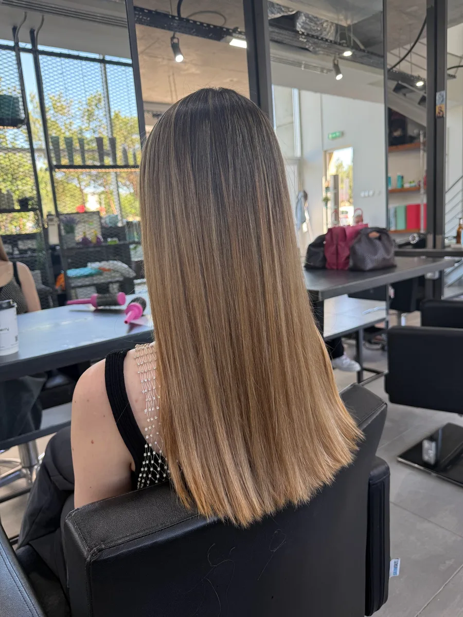 Long balayage from dark roots to caramel ends