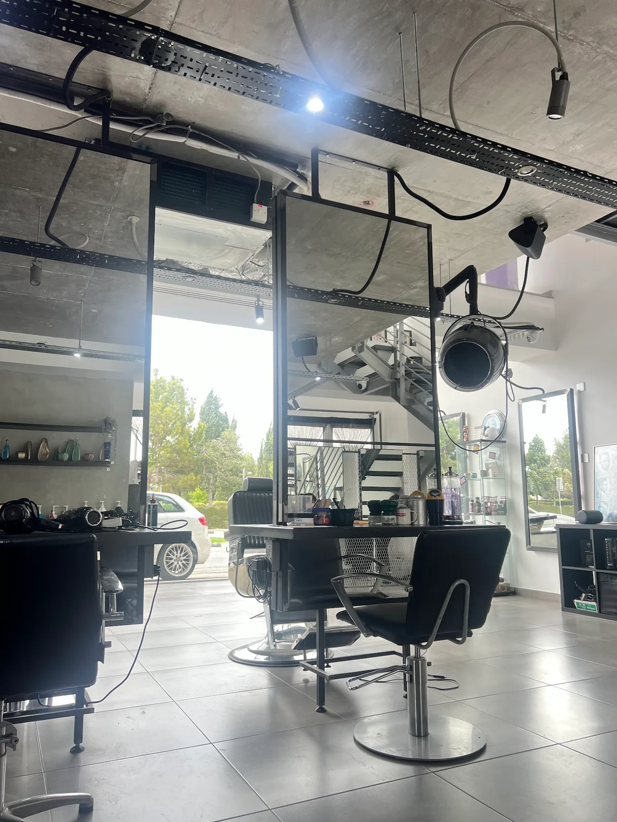 Bright salon floor with styling chairs and mirrors